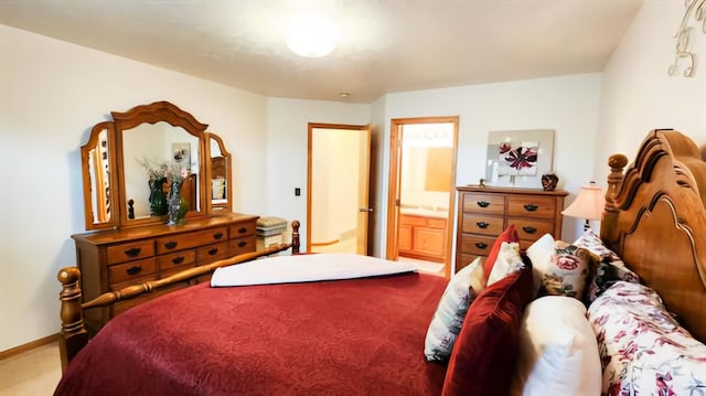 carpeted bedroom with ensuite bath