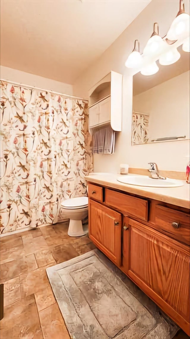 bathroom with vanity and toilet