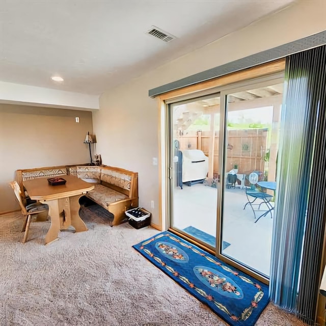 doorway featuring carpet floors