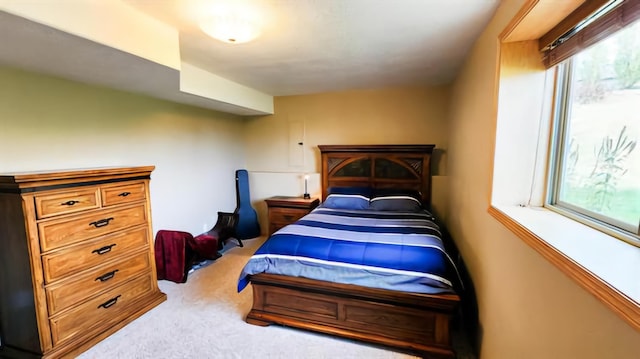 bedroom featuring light colored carpet