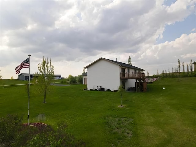 view of property exterior featuring a lawn and a wooden deck