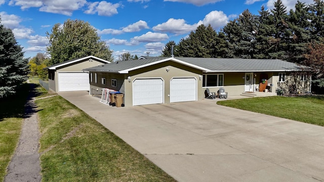 ranch-style home featuring a garage and a front yard