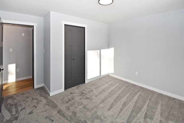 unfurnished bedroom with carpet and a closet