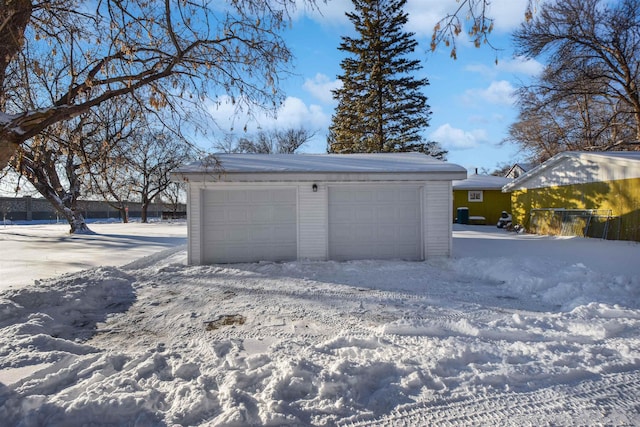 view of snow covered garage