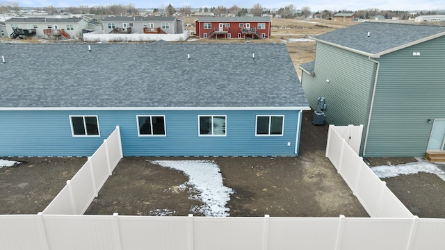 back of house featuring cooling unit