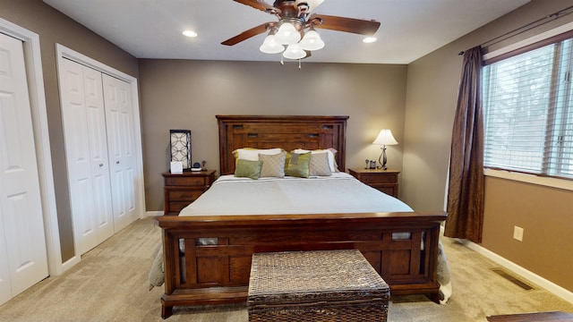 carpeted bedroom featuring ceiling fan