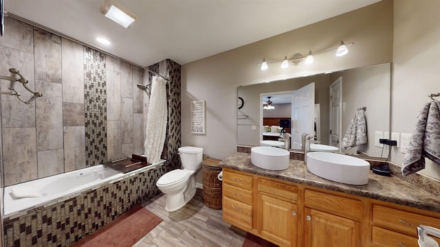 full bathroom with vanity, toilet, and shower / bath combo with shower curtain