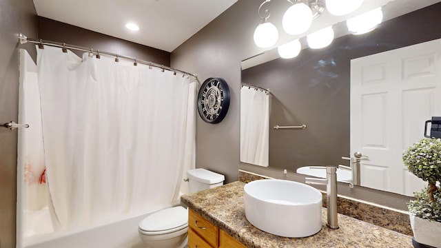 full bathroom featuring shower / tub combo, vanity, and toilet