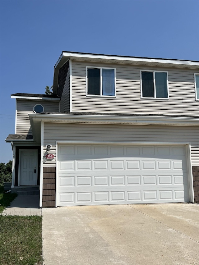 front of property with a garage