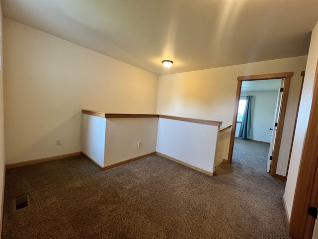 spare room featuring carpet floors