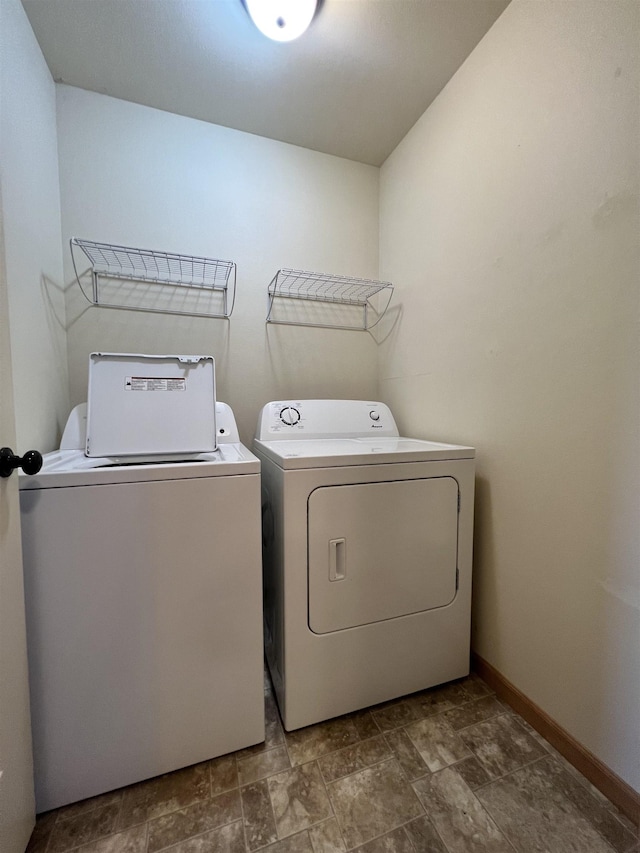 laundry room featuring washing machine and clothes dryer