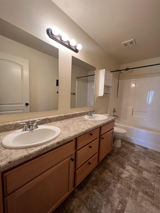 full bathroom featuring bathing tub / shower combination, vanity, and toilet