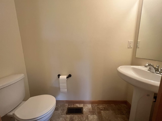 bathroom featuring sink and toilet