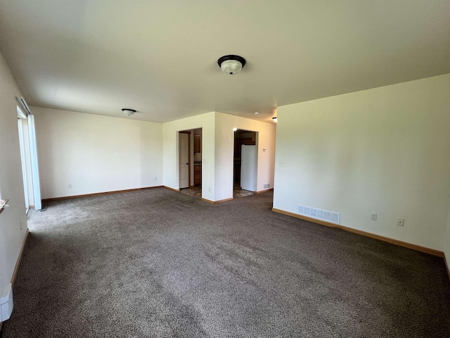 unfurnished room featuring carpet