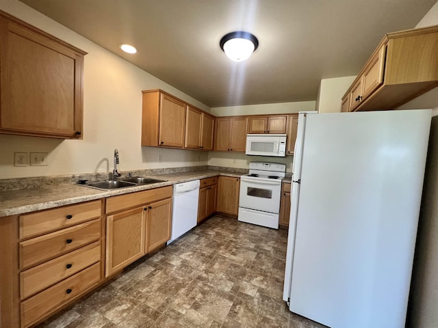 kitchen featuring white appliances and sink