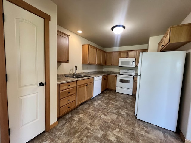 kitchen featuring white appliances and sink