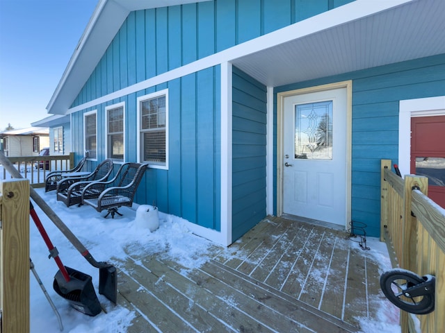 view of snow covered property entrance