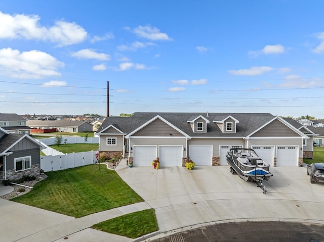 view of front facade featuring a garage and a front lawn