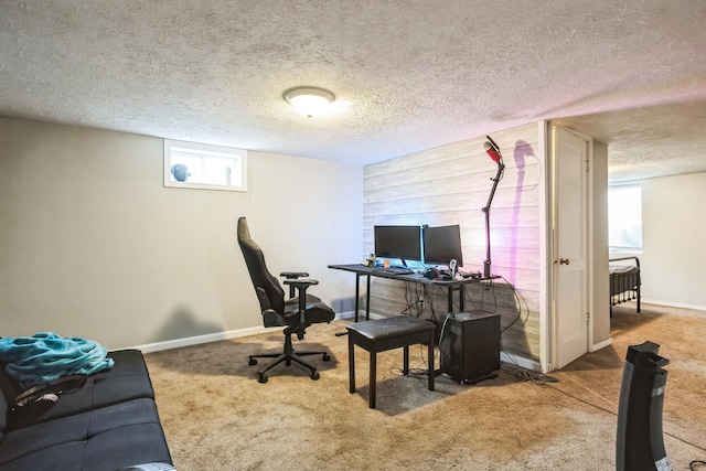 carpeted office space with a textured ceiling