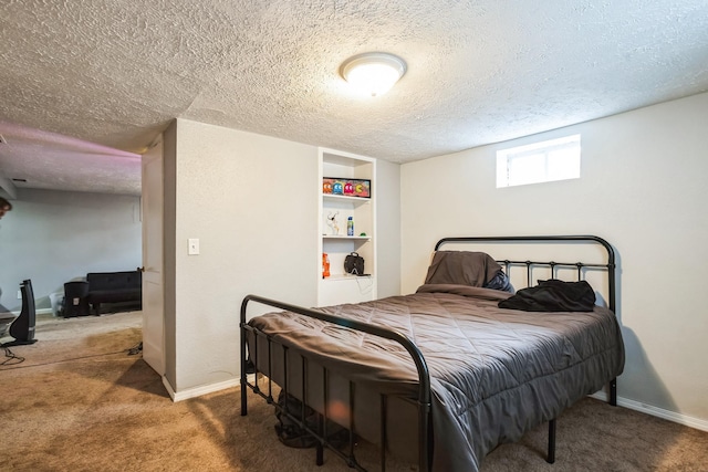 bedroom featuring dark carpet and a textured ceiling