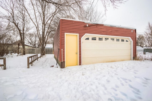 view of snow covered garage