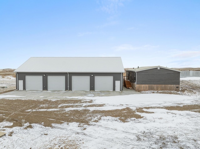 view of snow covered garage