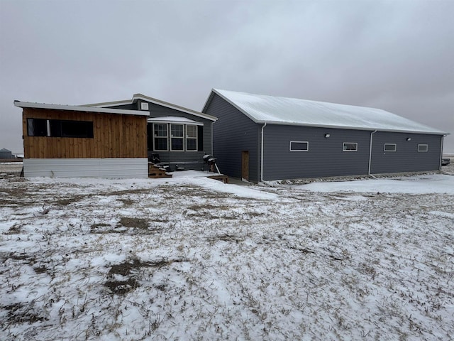 view of snow covered house