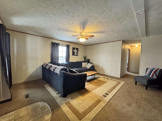 carpeted living room with ceiling fan, crown molding, and a textured ceiling