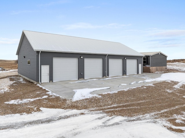 view of snow covered garage