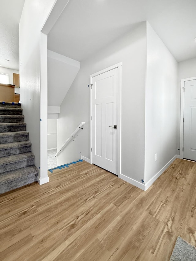 bonus room featuring light wood-type flooring