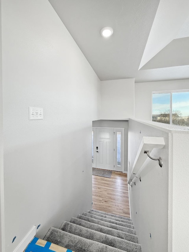 staircase featuring hardwood / wood-style floors