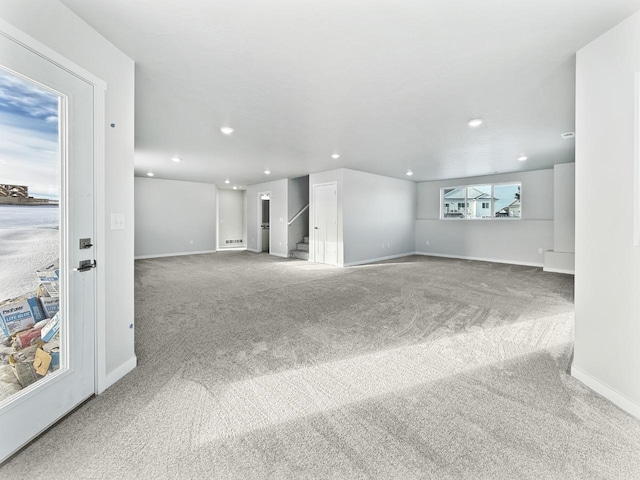 unfurnished living room with carpet