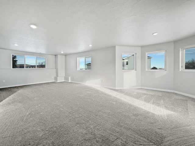 empty room featuring carpet floors and a textured ceiling