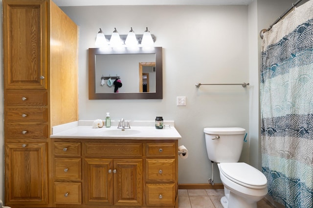 bathroom featuring walk in shower, tile patterned flooring, vanity, and toilet