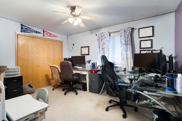 carpeted office with ceiling fan