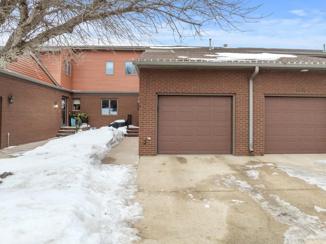 view of snow covered garage