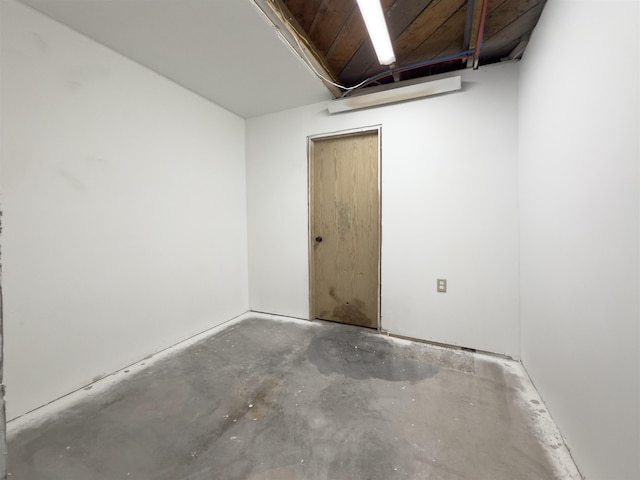 spare room with concrete flooring