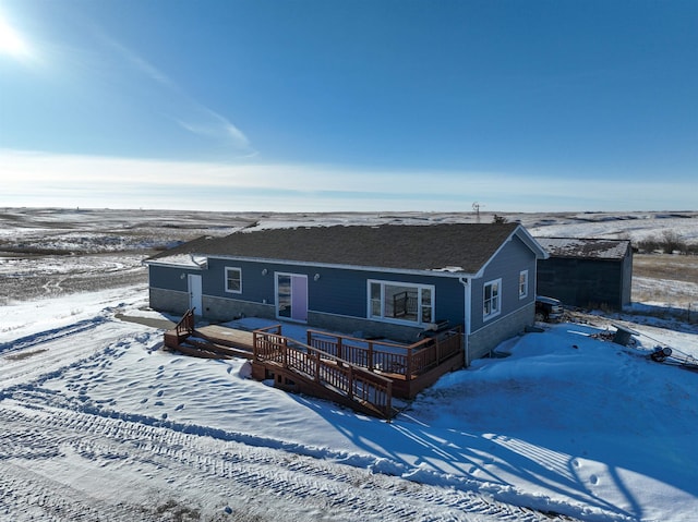 ranch-style home featuring a deck