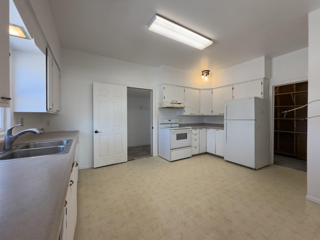 kitchen featuring sink, white cabinets, and white appliances