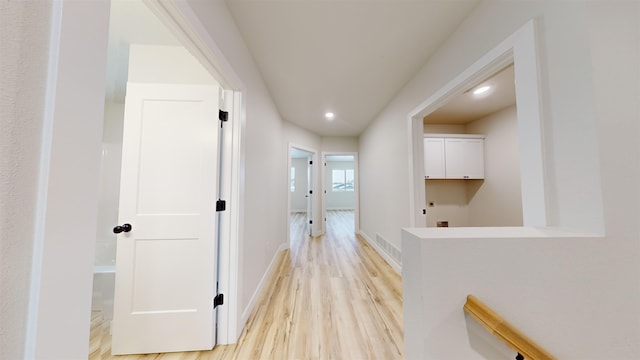 corridor featuring light wood-type flooring