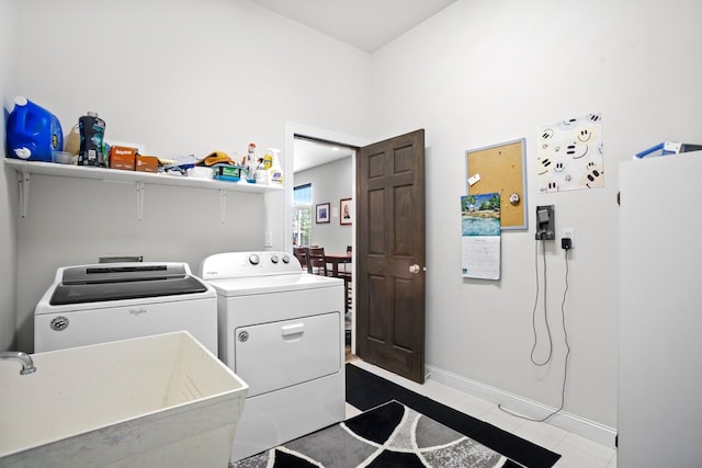 laundry room featuring washer and clothes dryer and sink