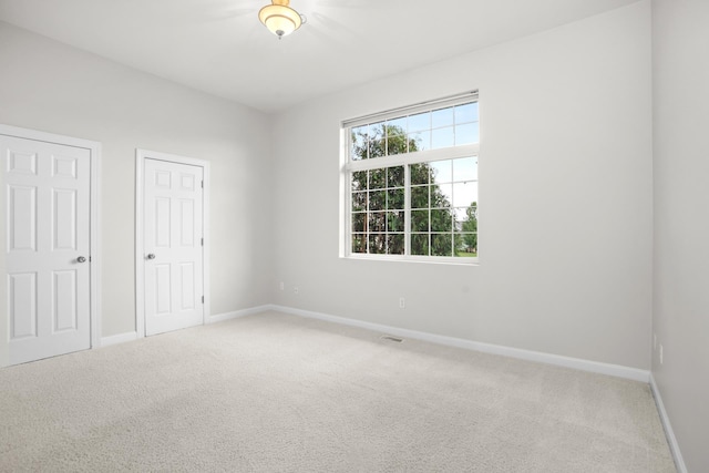 unfurnished bedroom featuring carpet flooring