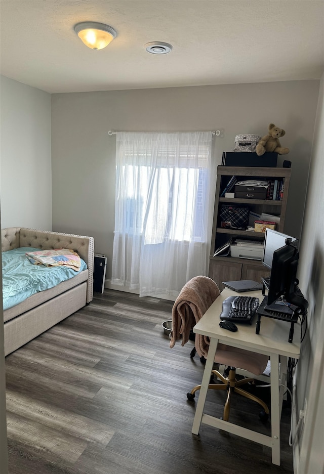 bedroom featuring hardwood / wood-style flooring