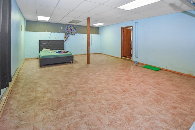 basement featuring a paneled ceiling