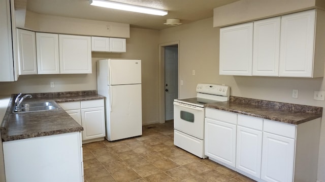 kitchen with white cabinets, white appliances, and sink