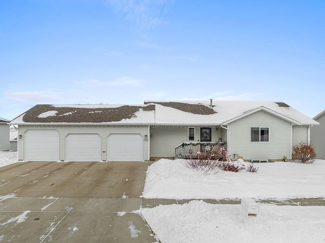 ranch-style home featuring a garage