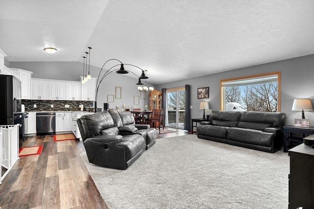 living room featuring lofted ceiling and dark hardwood / wood-style flooring