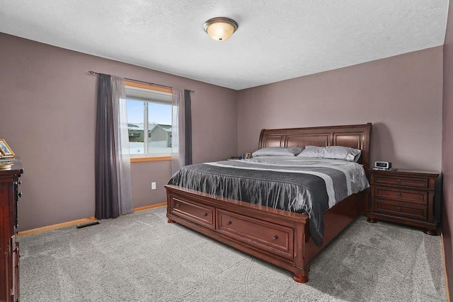 carpeted bedroom with a textured ceiling