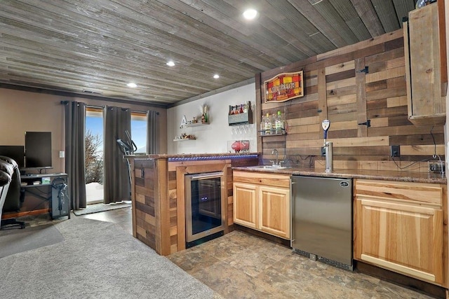 bar with wood ceiling, beverage cooler, dark carpet, refrigerator, and sink