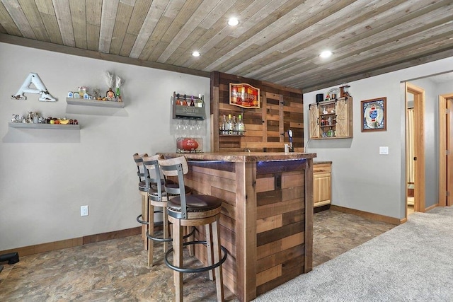 bar with wood ceiling and carpet flooring